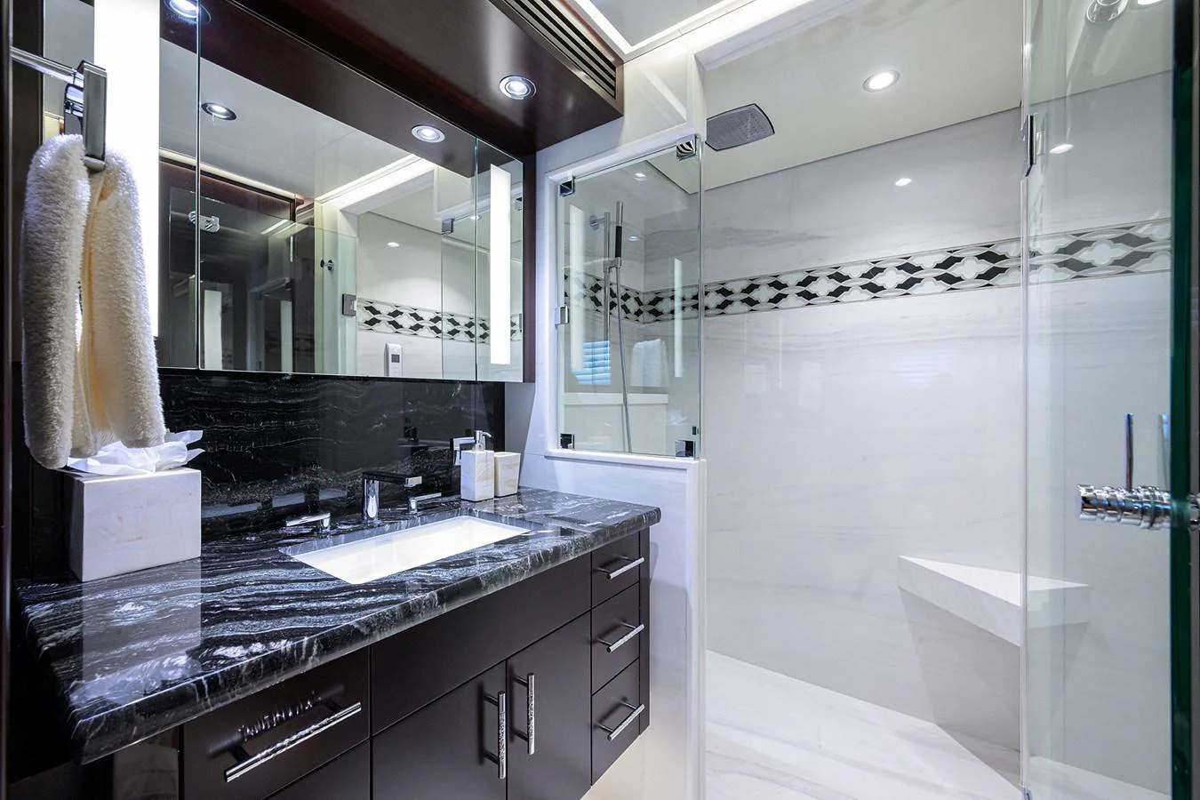 a bathroom with a large mirror aboard RENNEGADE Yacht for Sale