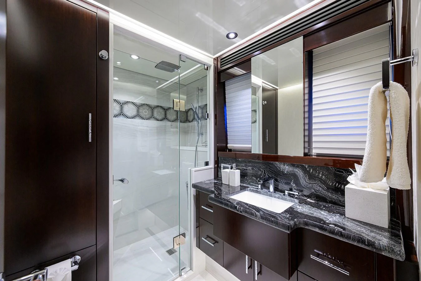 a bathroom with a glass shower aboard RENNEGADE Yacht for Sale