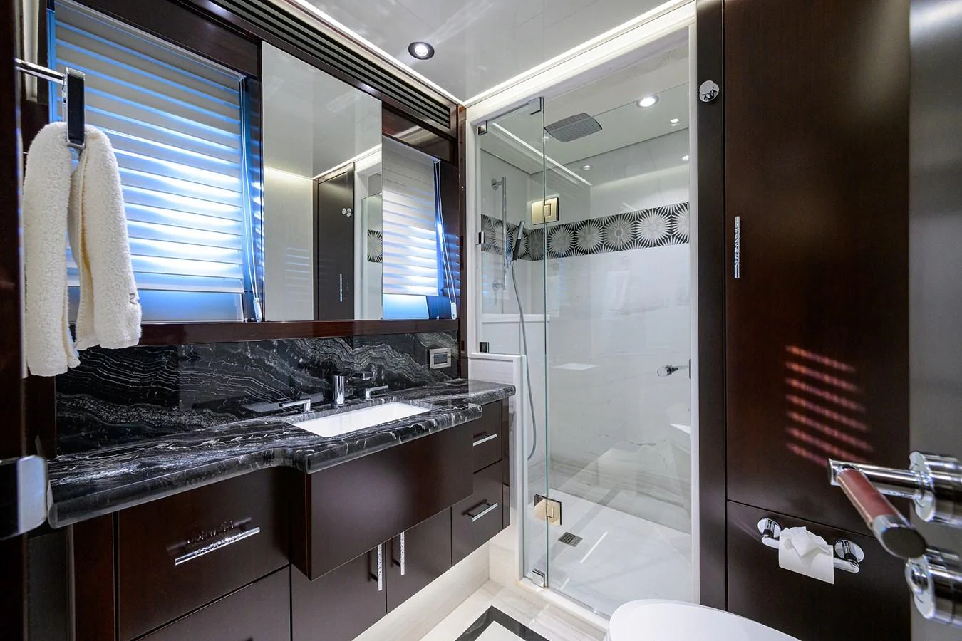 a bathroom with a glass shower aboard RENNEGADE Yacht for Sale