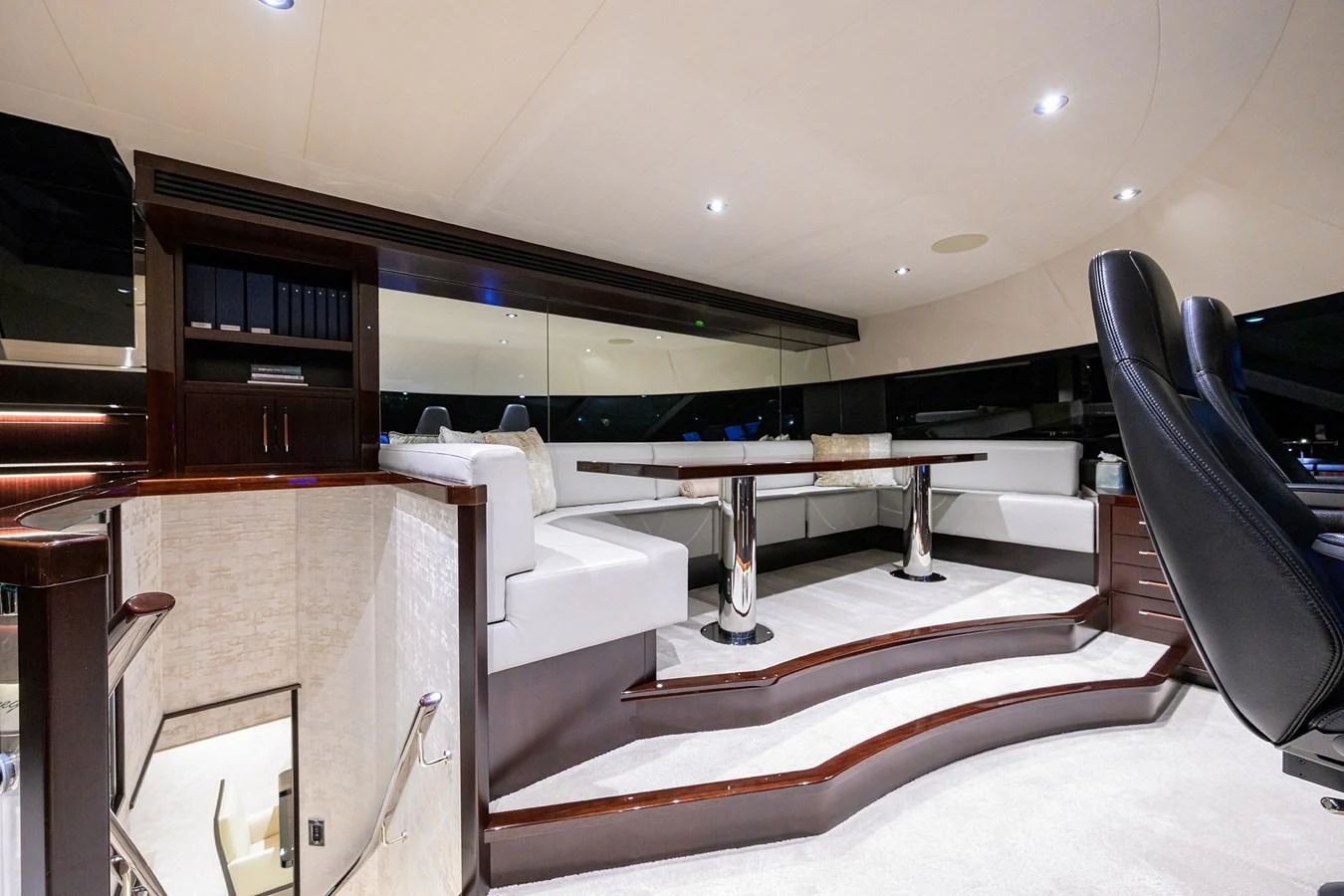 a room with a desk and chairs aboard RENNEGADE Yacht for Sale