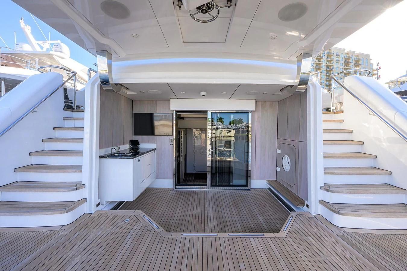 a long hallway with a staircase aboard RENNEGADE Yacht for Sale