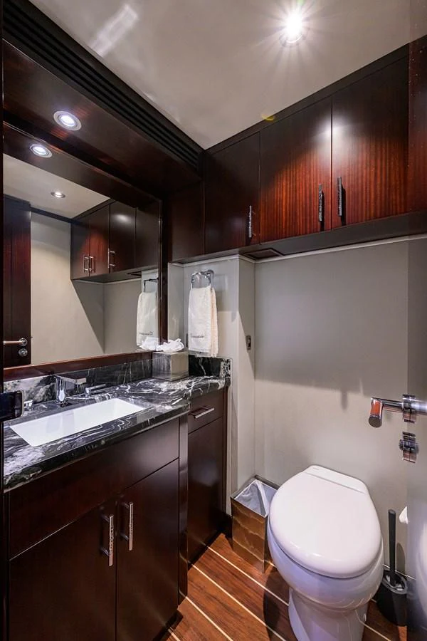 a bathroom with a toilet and sink aboard RENNEGADE Yacht for Sale
