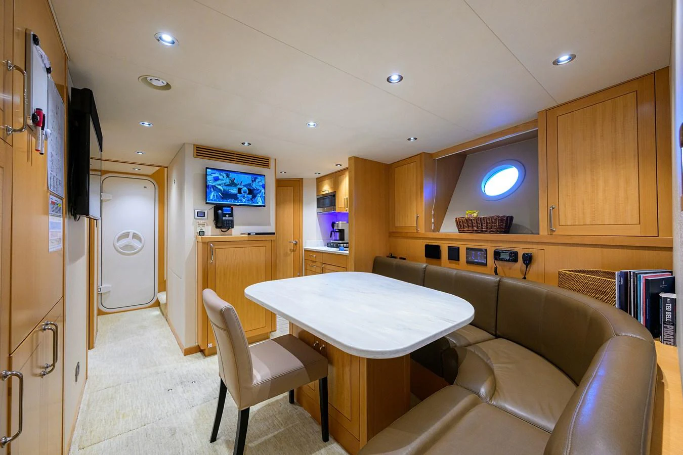 a room with a table and chairs aboard RENNEGADE Yacht for Sale