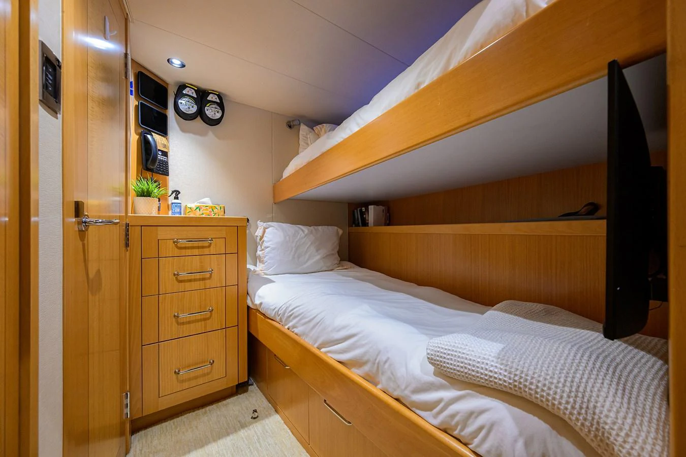 a bedroom with a bunk bed aboard RENNEGADE Yacht for Sale