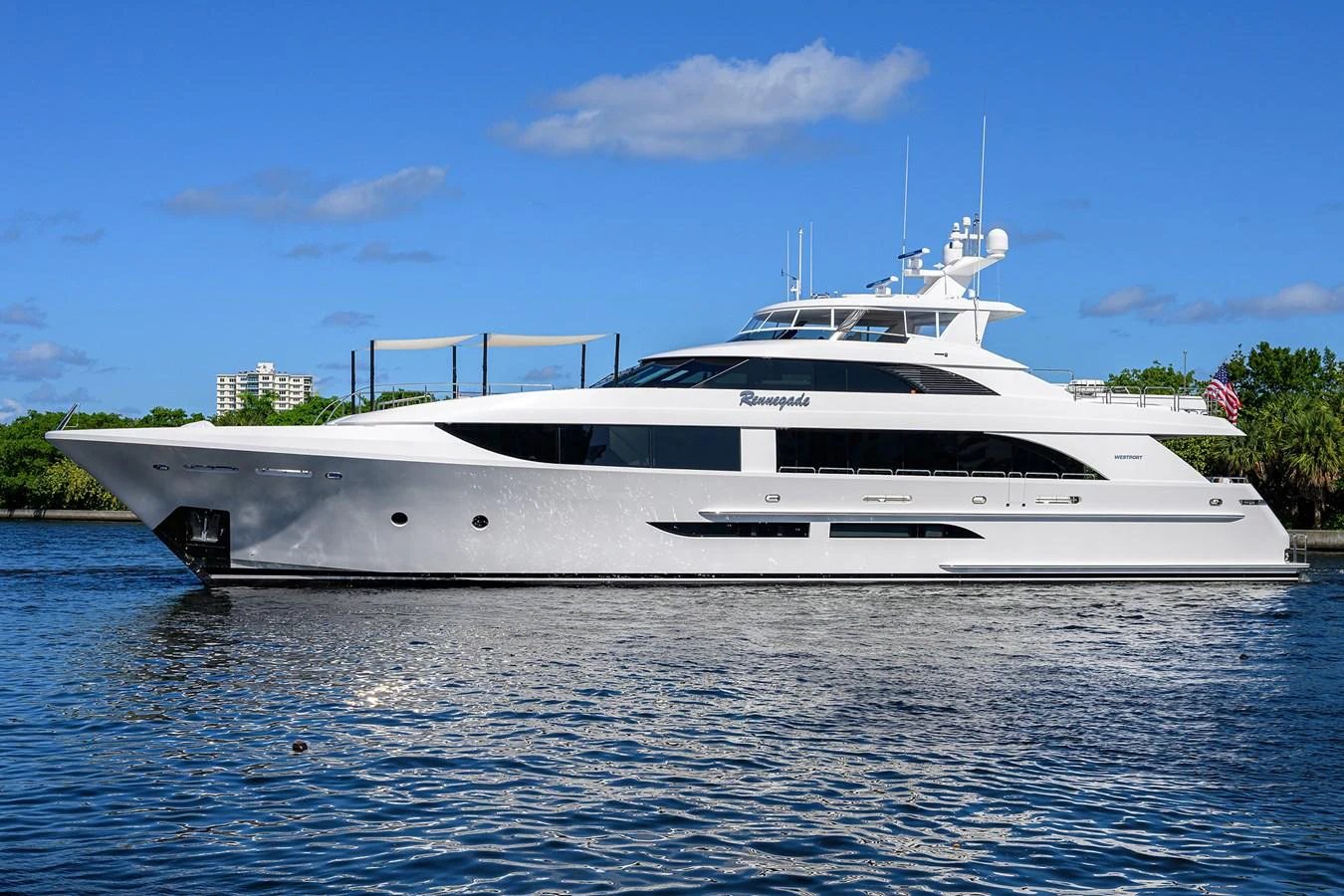 a white yacht on the water aboard RENNEGADE Yacht for Sale