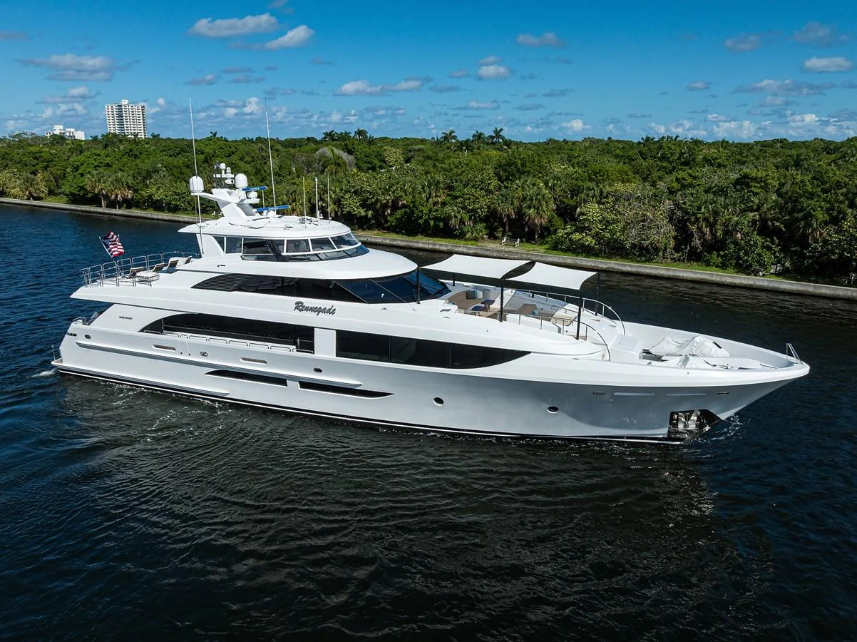 a white yacht in the water aboard RENNEGADE Yacht for Sale