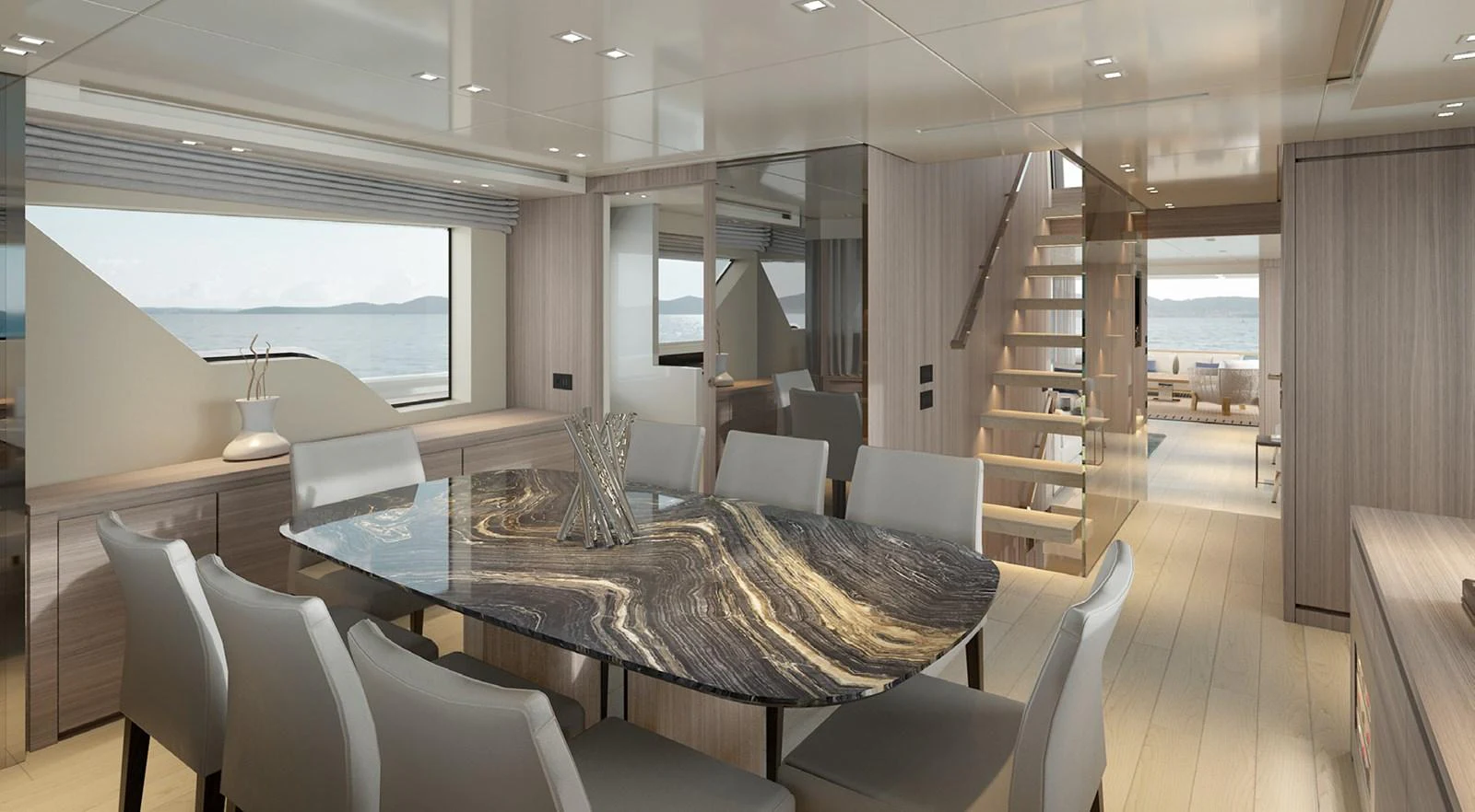 a large room with a table and chairs aboard SIXTYFIVE Yacht for Sale