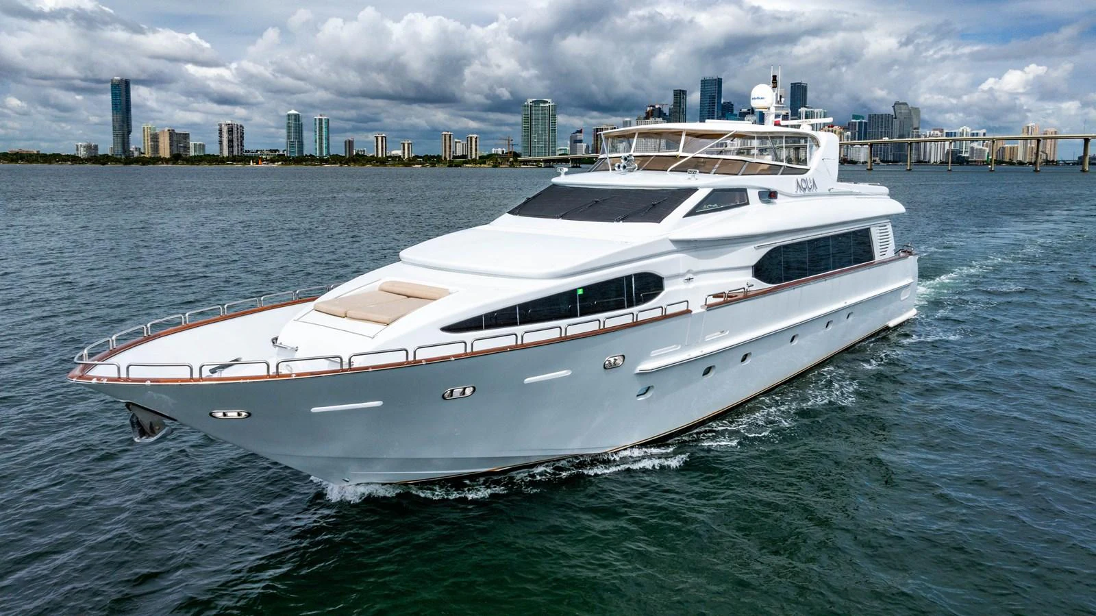 a white yacht in the water aboard AQUA Yacht for Sale