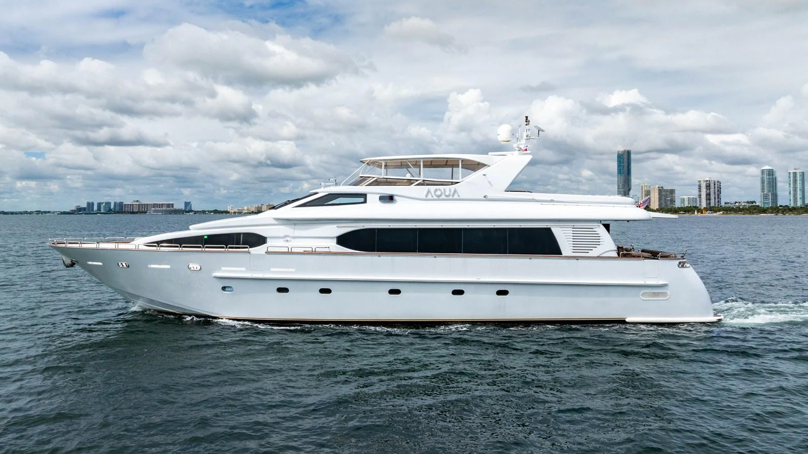 a white yacht in the water aboard AQUA Yacht for Sale