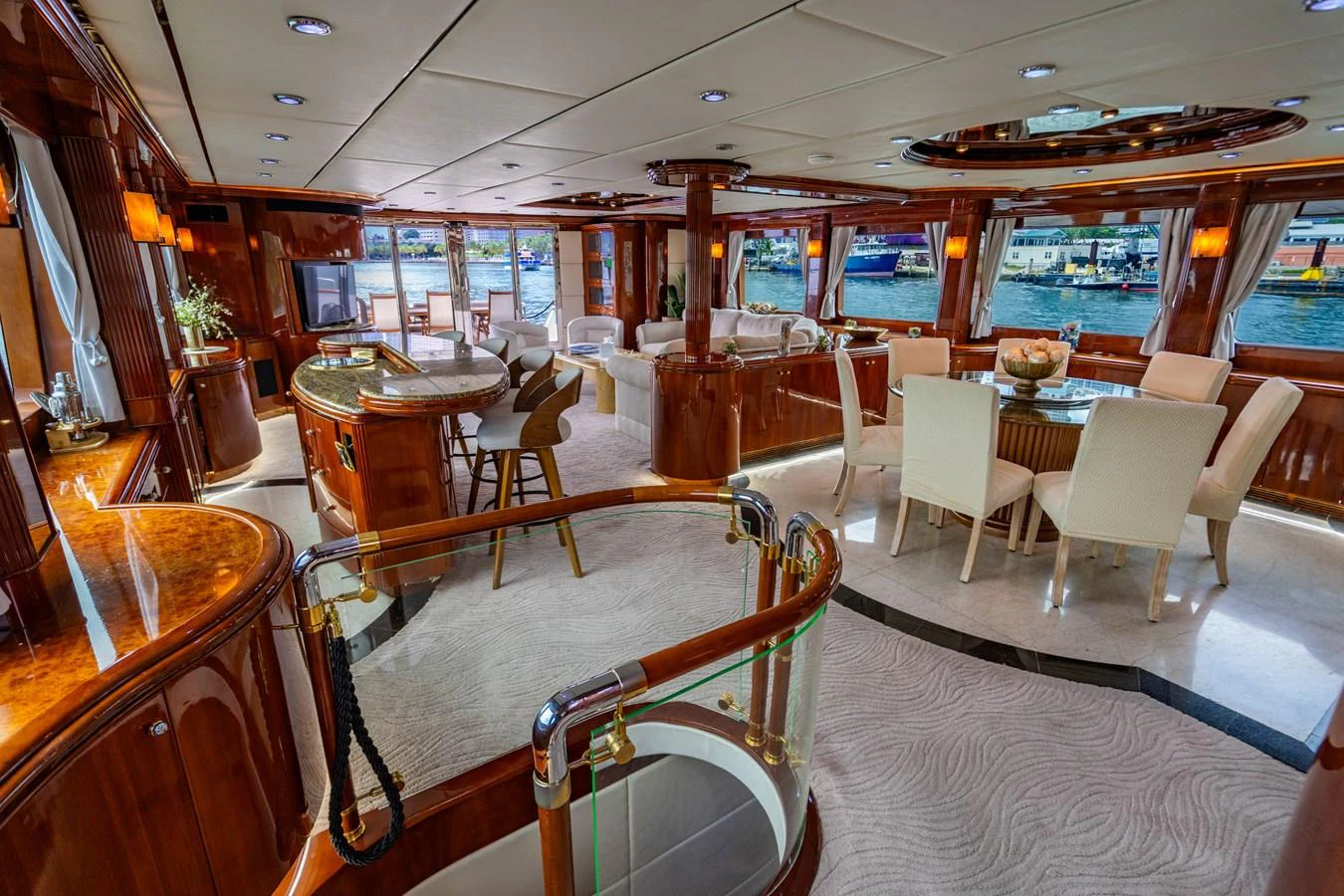 inside of a building with tables and chairs aboard AQUA Yacht for Sale