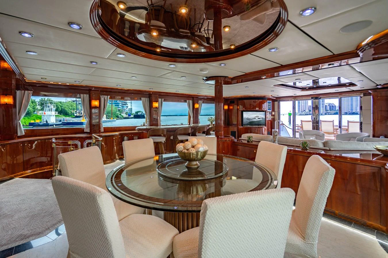 a room with a table and chairs aboard AQUA Yacht for Sale