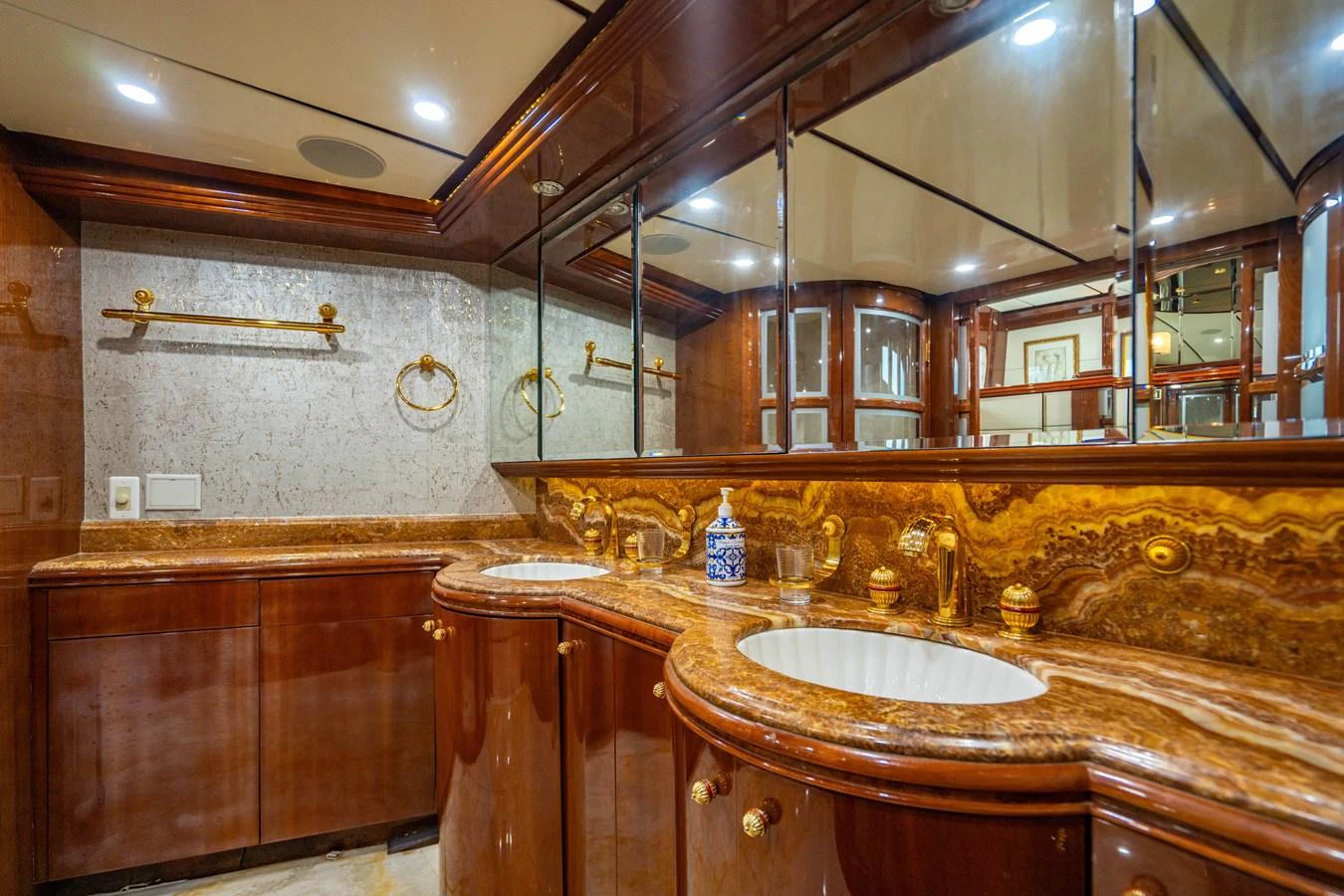 a bathroom with a large mirror aboard AQUA Yacht for Sale