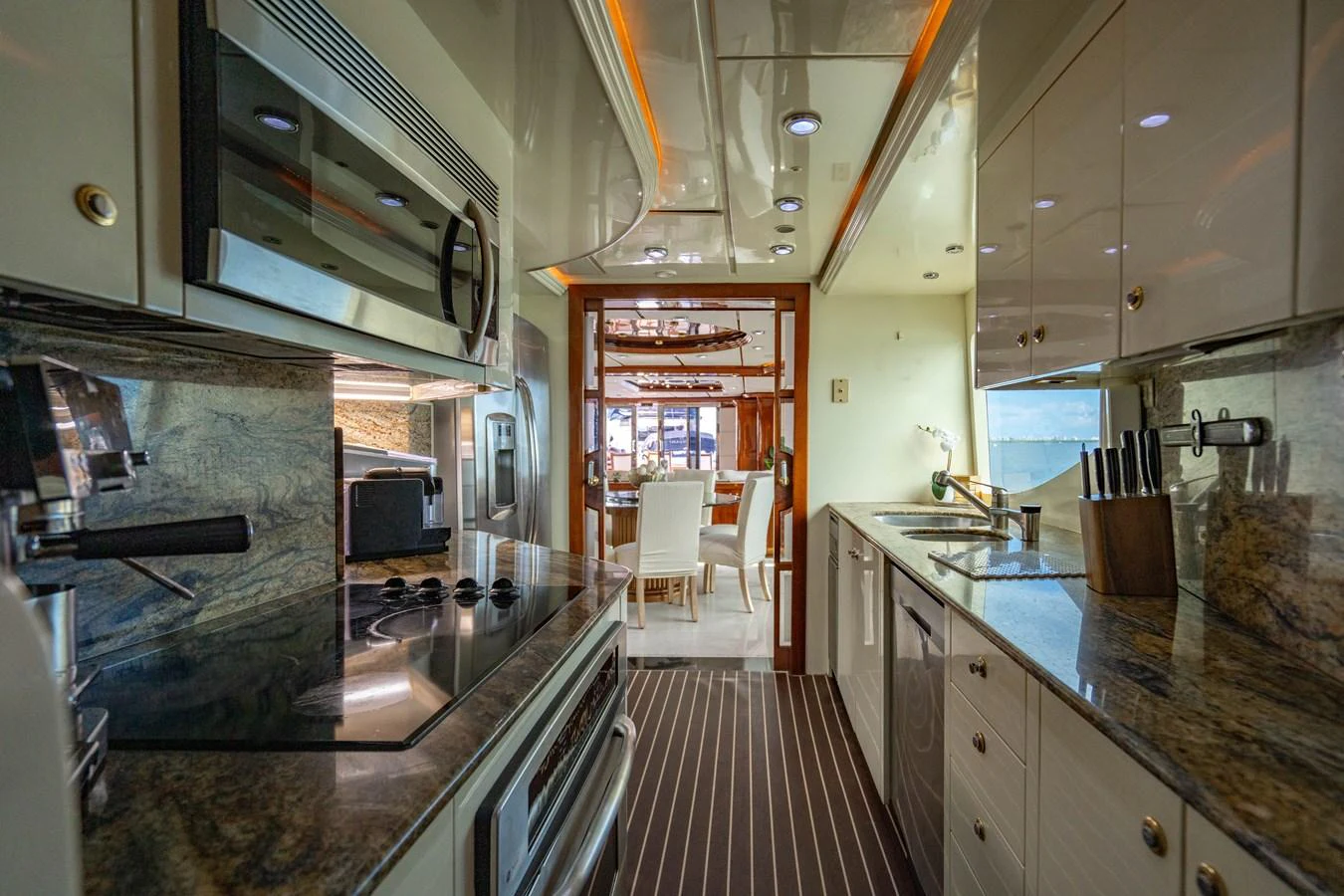 a kitchen with a large island aboard AQUA Yacht for Sale