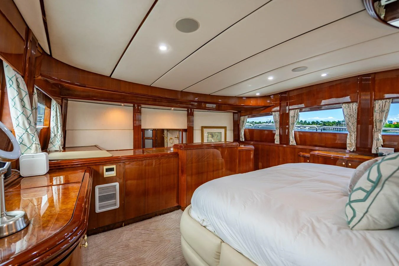 a bedroom with a bed and a desk aboard AQUA Yacht for Sale