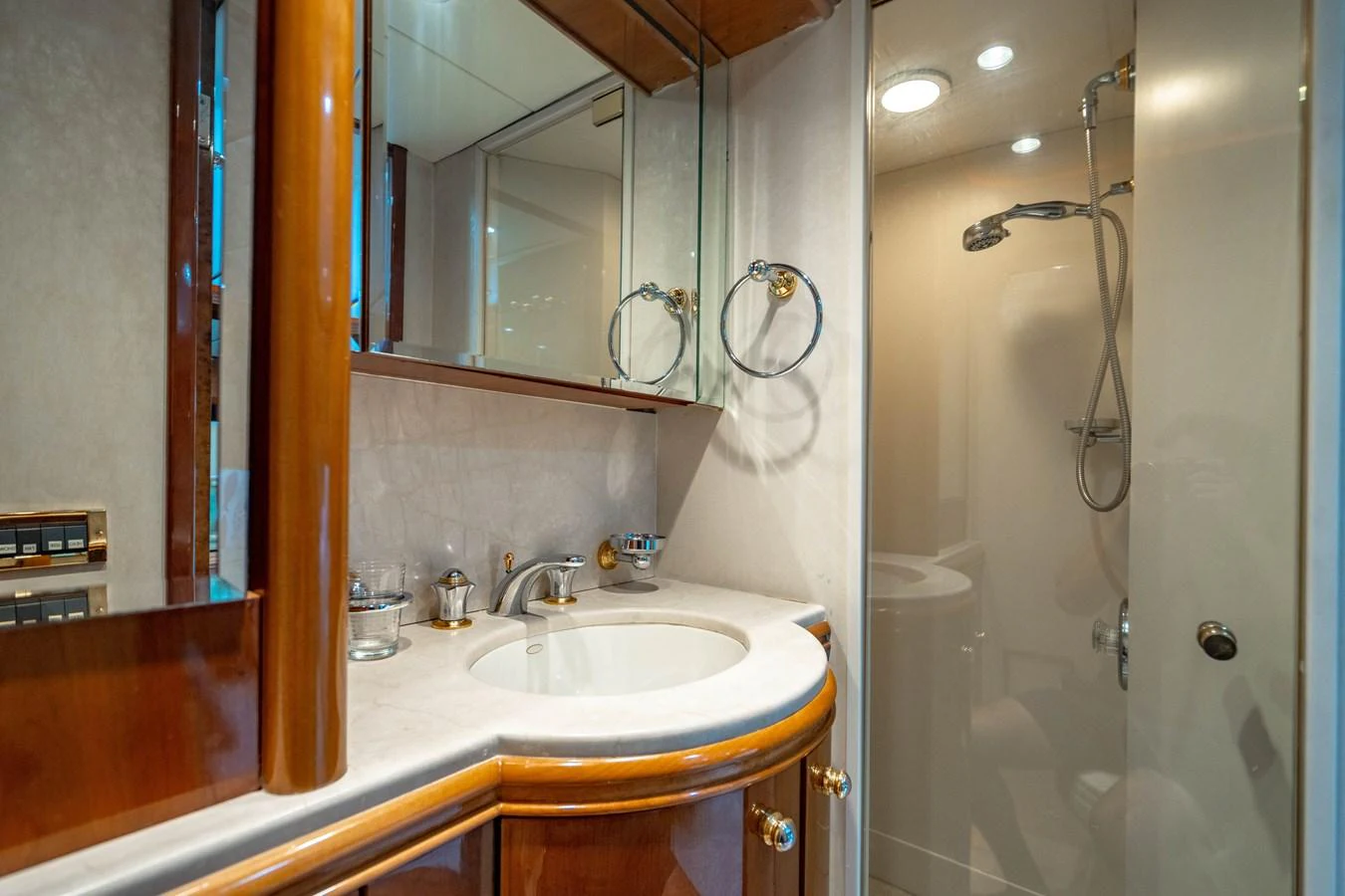 a bathroom with a sink and a mirror aboard AQUA Yacht for Sale