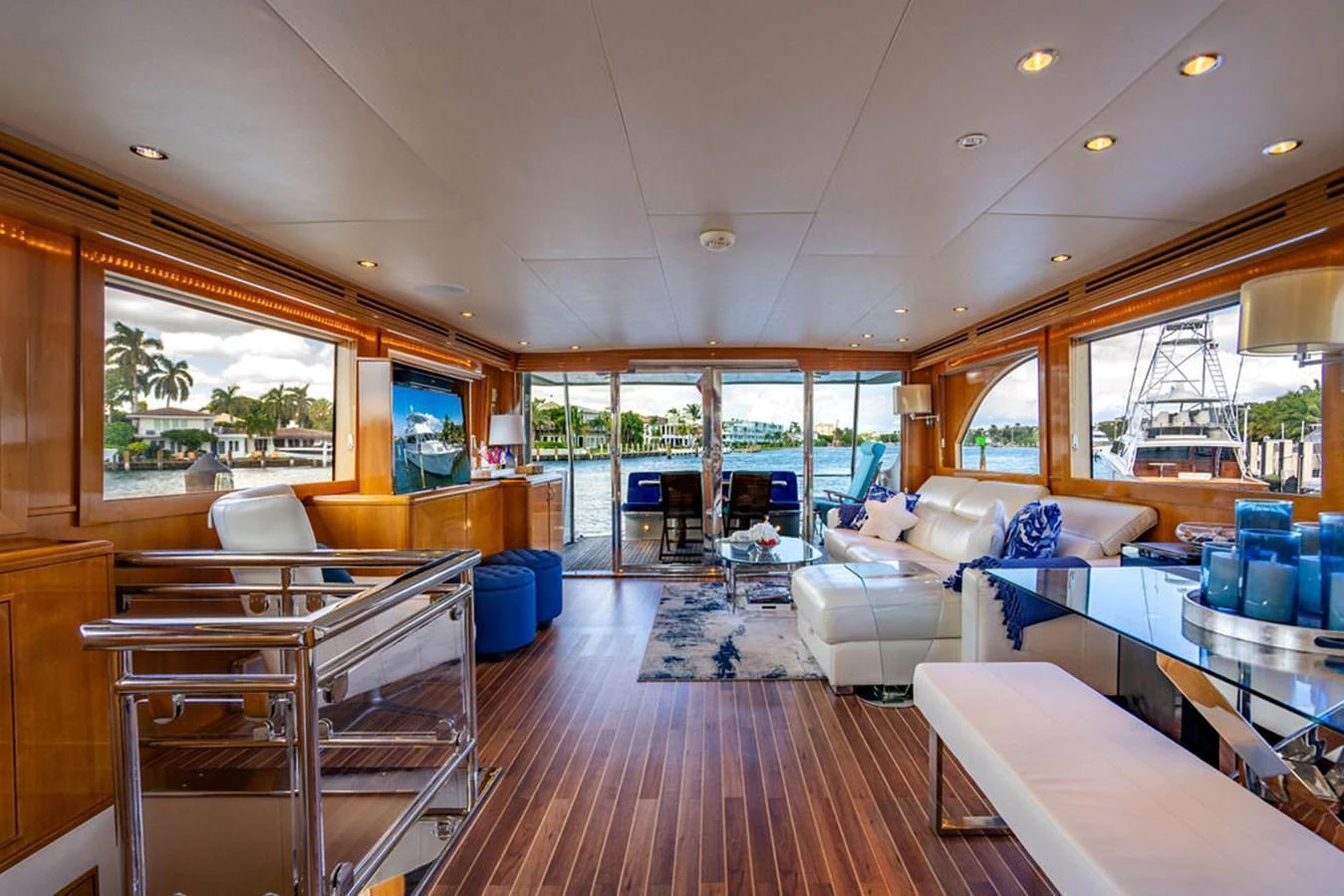 The yacht's salon features luxurious seating, elegant decor, and expansive windows offering stunning views. aboard WATER BORN Yacht for Sale