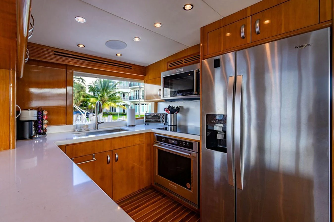 The galley features modern appliances and a sleek design with a view of the surroundings. aboard WATER BORN Yacht for Sale