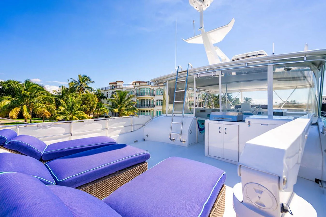 The flybridge offers a spacious lounging area with plush seating and panoramic views. aboard WATER BORN Yacht for Sale
