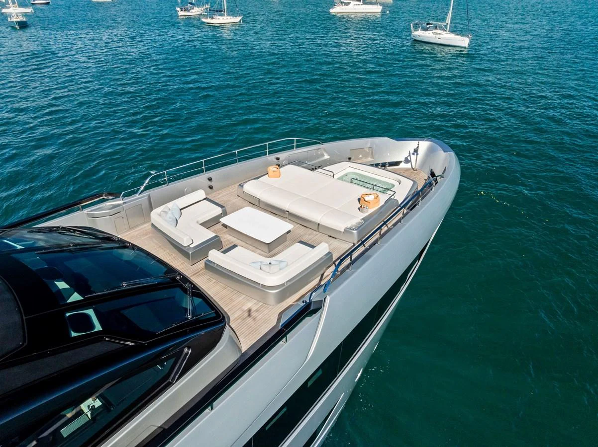 The yacht's foredeck features luxurious sun loungers and a jacuzzi, perfect for relaxation. aboard TENACIOUS Yacht for Sale