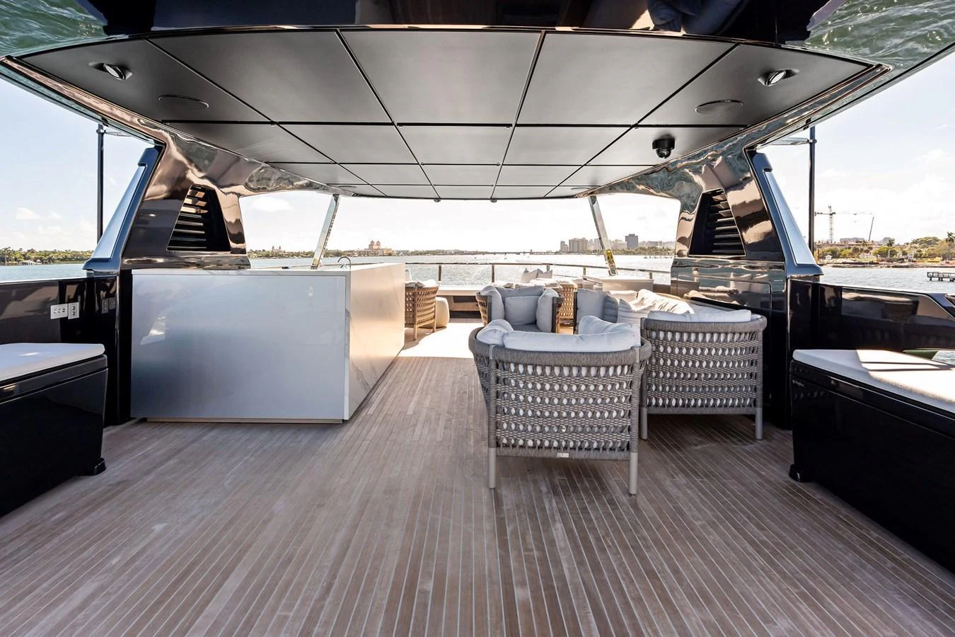 The flybridge offers a spacious and luxurious seating area with panoramic views. aboard TENACIOUS Yacht for Sale