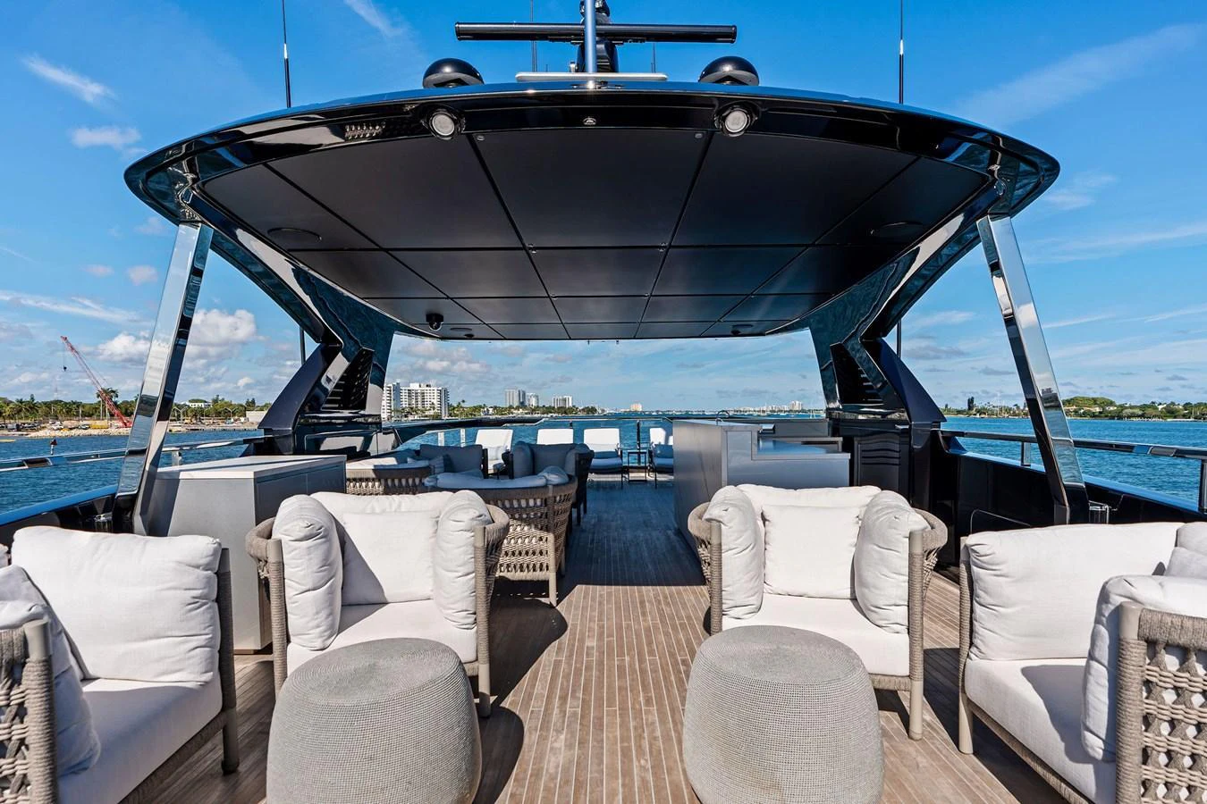 The flybridge offers a spacious and luxurious outdoor seating area with stunning views. aboard TENACIOUS Yacht for Sale