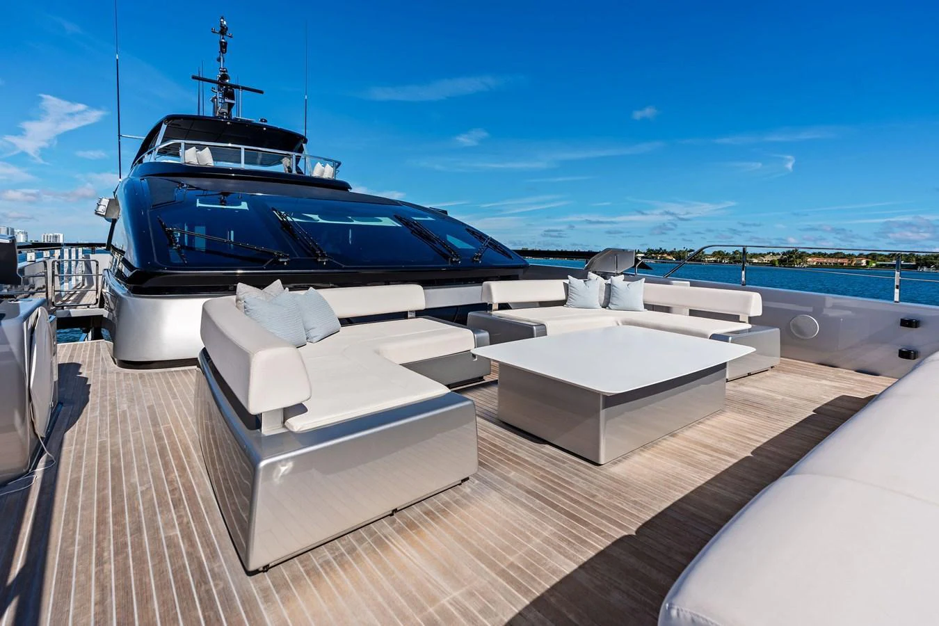 The sundeck features luxurious seating and a spacious layout for relaxation and entertainment. aboard TENACIOUS Yacht for Sale