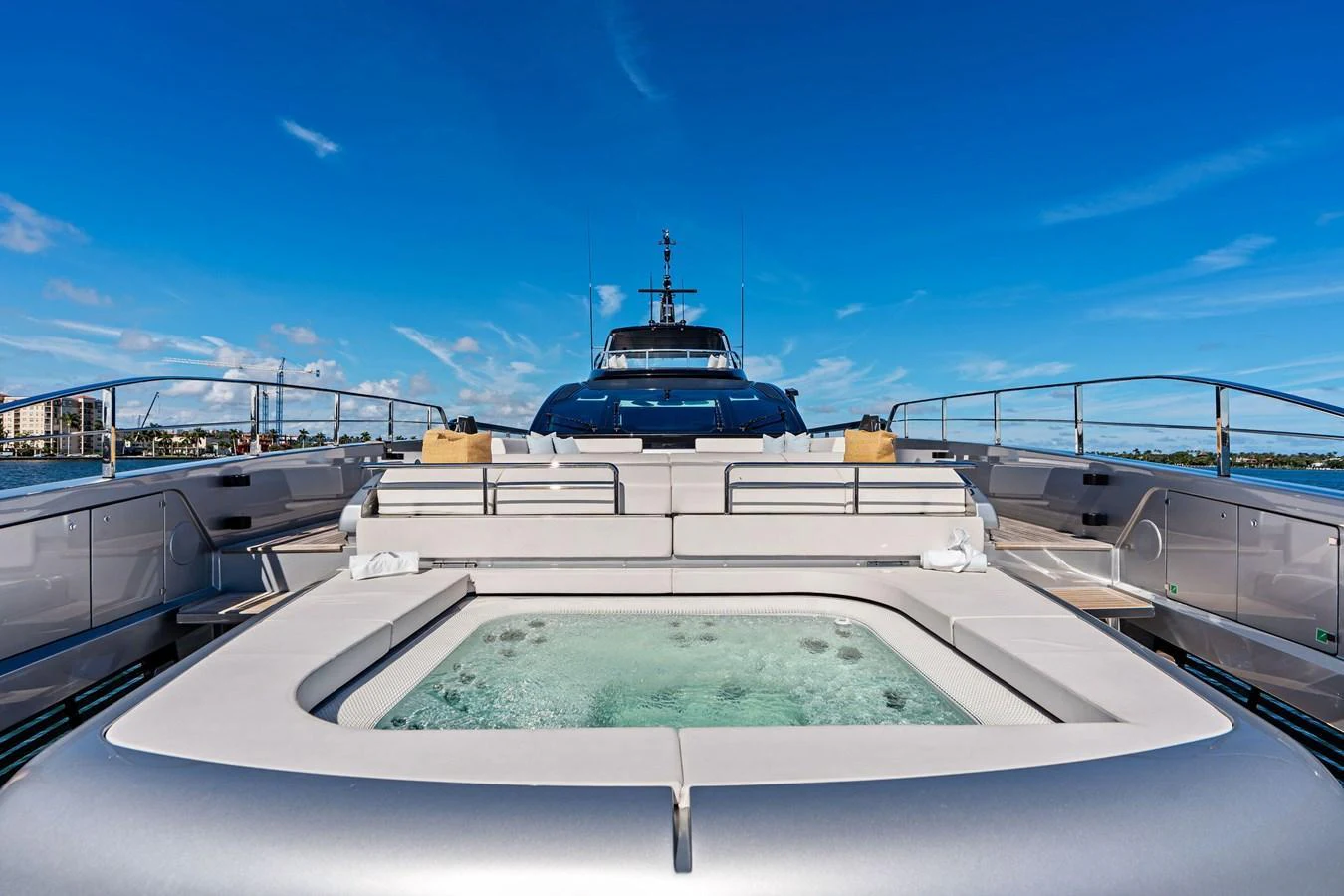 The sundeck features a luxurious jacuzzi with ample seating and stunning views. aboard TENACIOUS Yacht for Sale