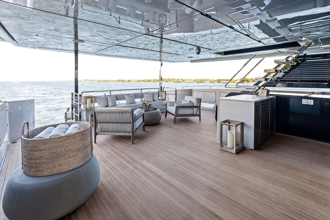Spacious aft deck with comfortable seating and modern amenities, perfect for relaxation and socializing. aboard TENACIOUS Yacht for Sale