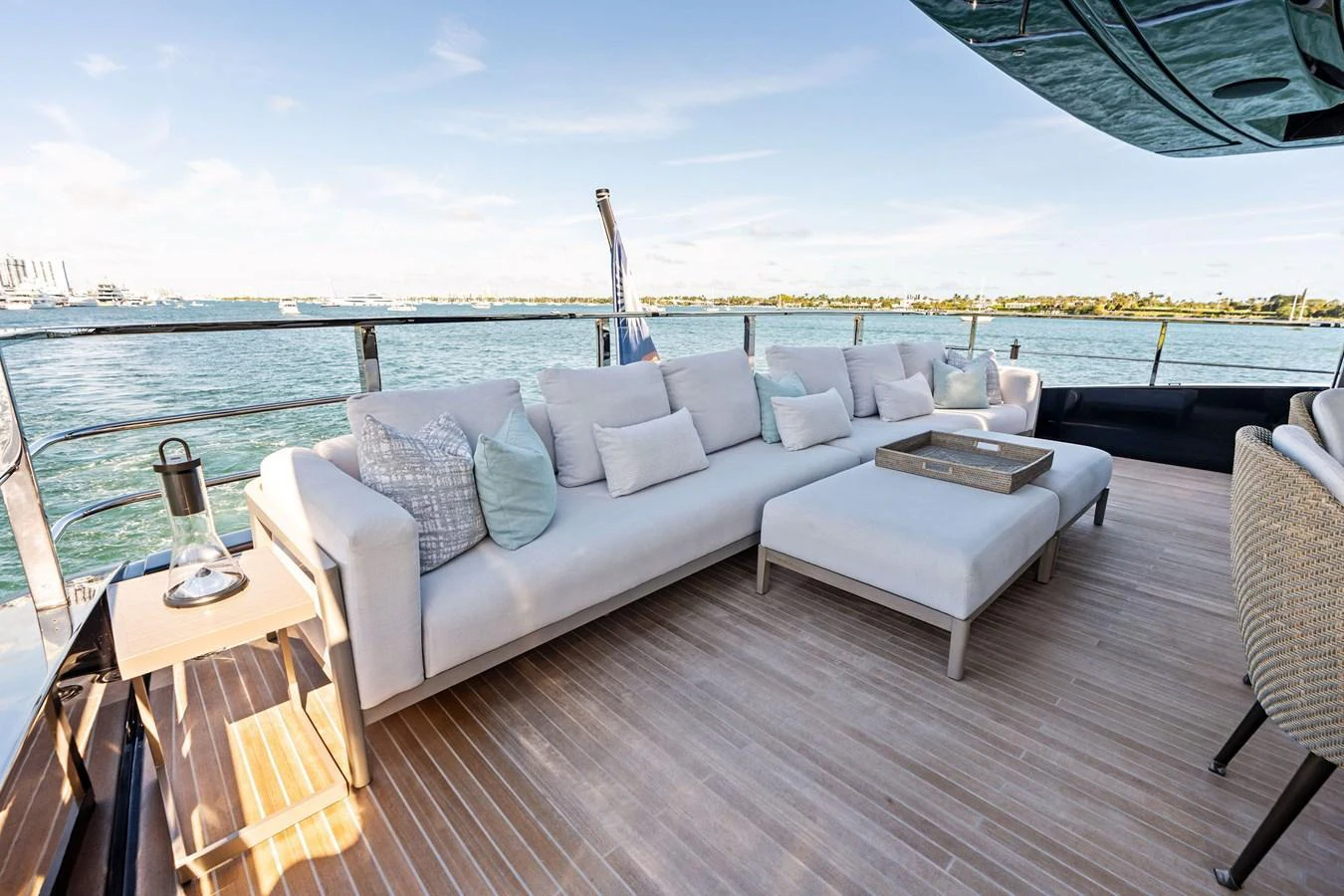 The aft deck features a spacious and comfortable seating area with a stunning view of the water. aboard TENACIOUS Yacht for Sale