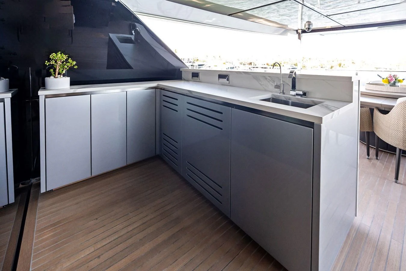 The yacht's galley features sleek cabinetry and modern appliances, perfect for gourmet cooking at sea. aboard TENACIOUS Yacht for Sale