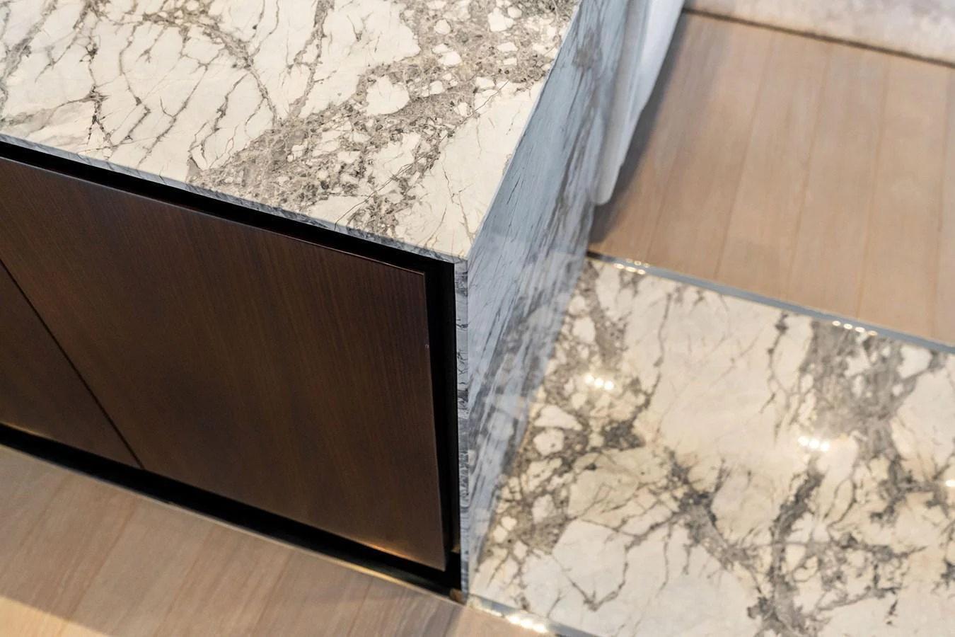 The image showcases a luxurious marble finish on a yacht's interior surface. aboard TENACIOUS Yacht for Sale