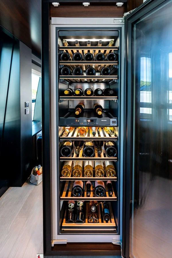 A well-stocked wine cellar with an impressive selection of fine wines. aboard TENACIOUS Yacht for Sale