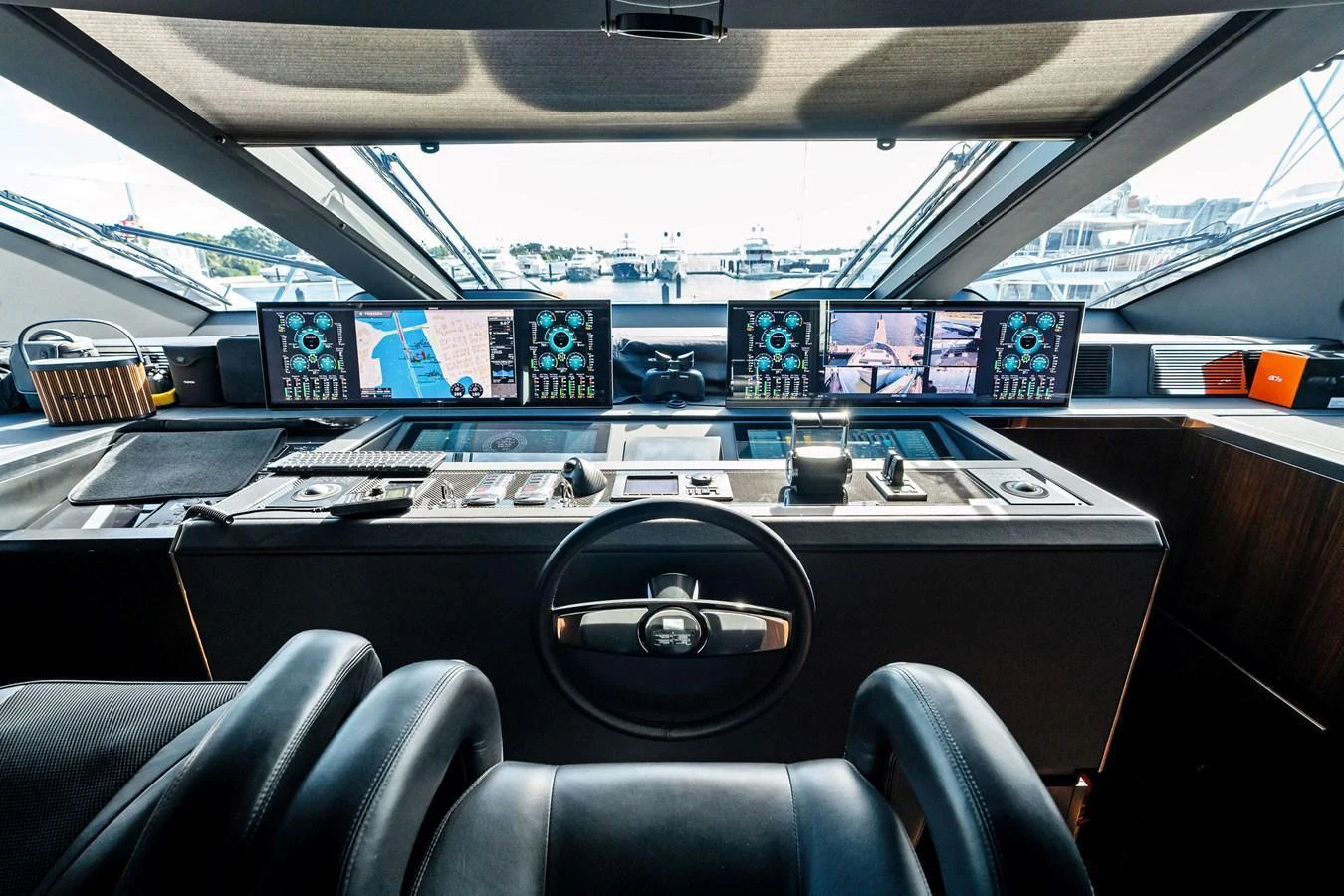 The helm station is equipped with advanced navigation systems and luxurious seating. aboard TENACIOUS Yacht for Sale