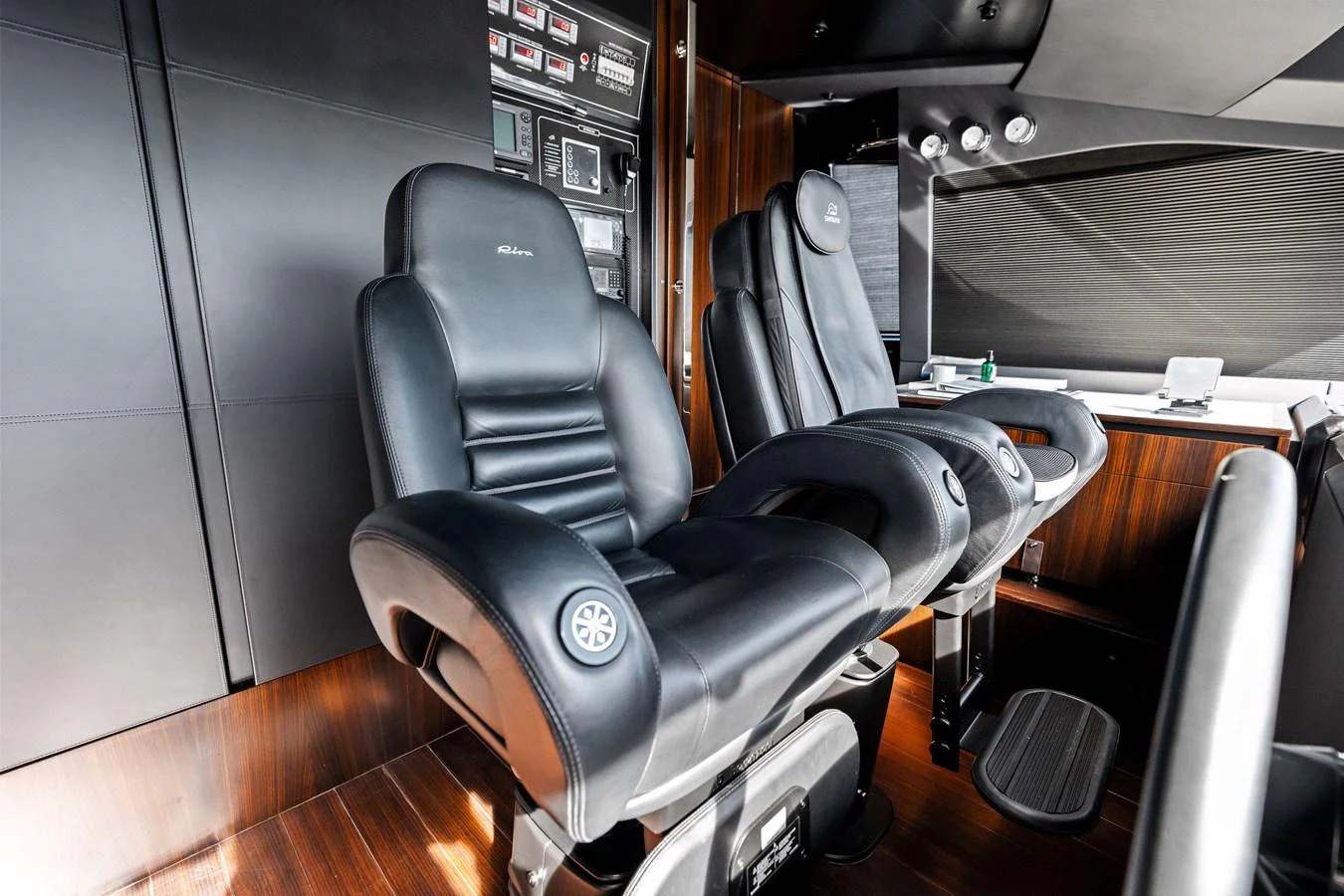 The helm features luxurious leather captain's chairs and advanced navigation equipment. aboard TENACIOUS Yacht for Sale