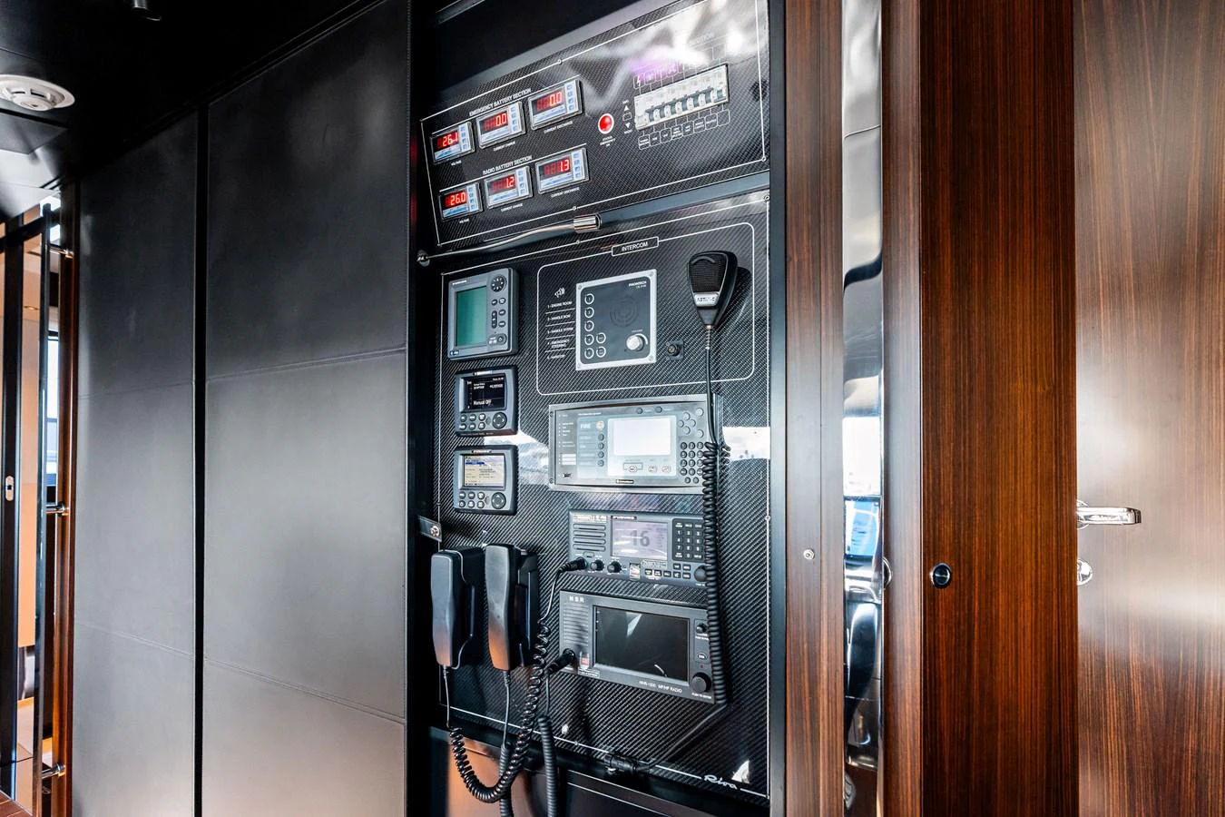 The yacht's control panel showcases advanced navigation and communication equipment. aboard TENACIOUS Yacht for Sale