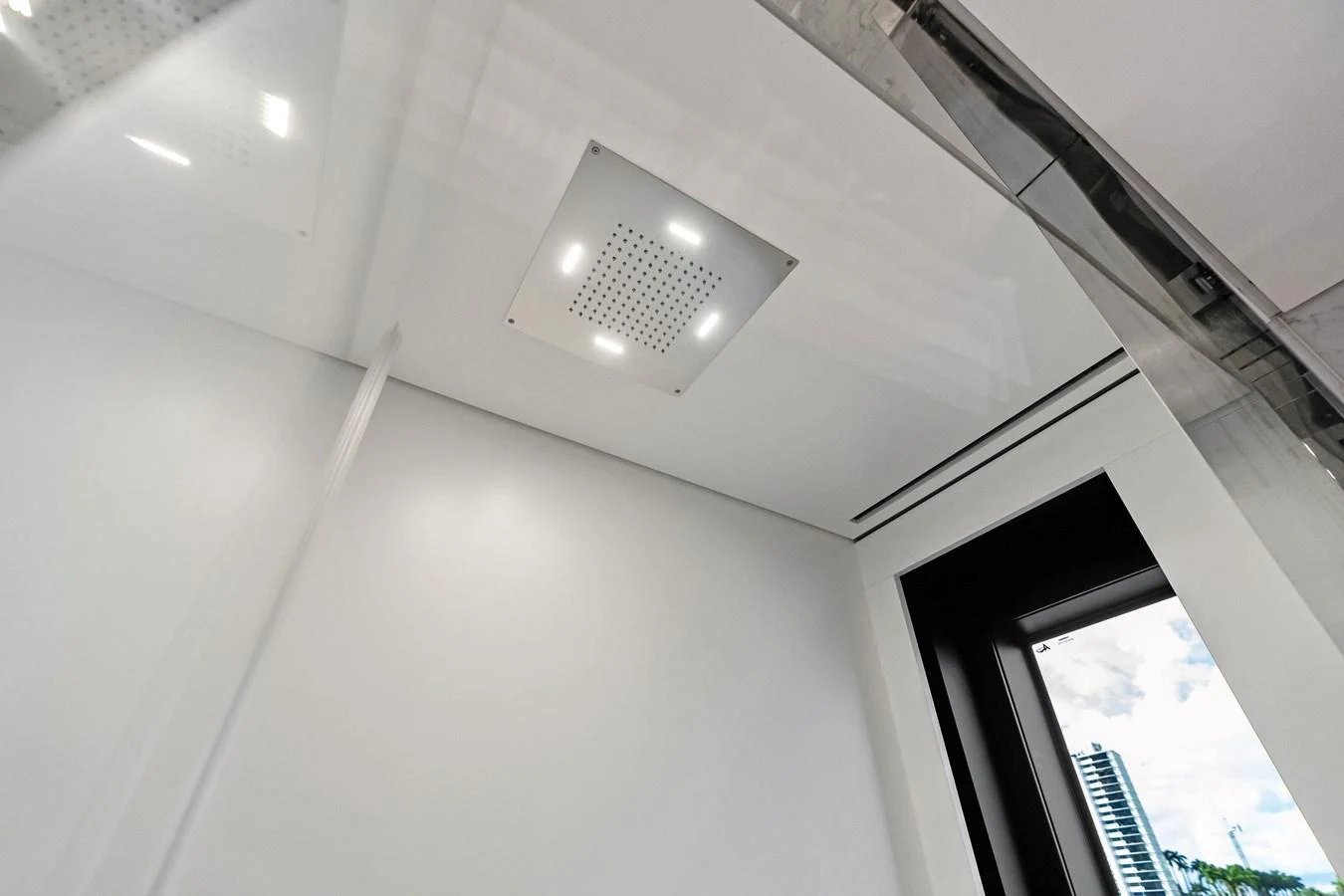 The image shows a modern, well-lit interior ceiling with a sleek design. aboard TENACIOUS Yacht for Sale