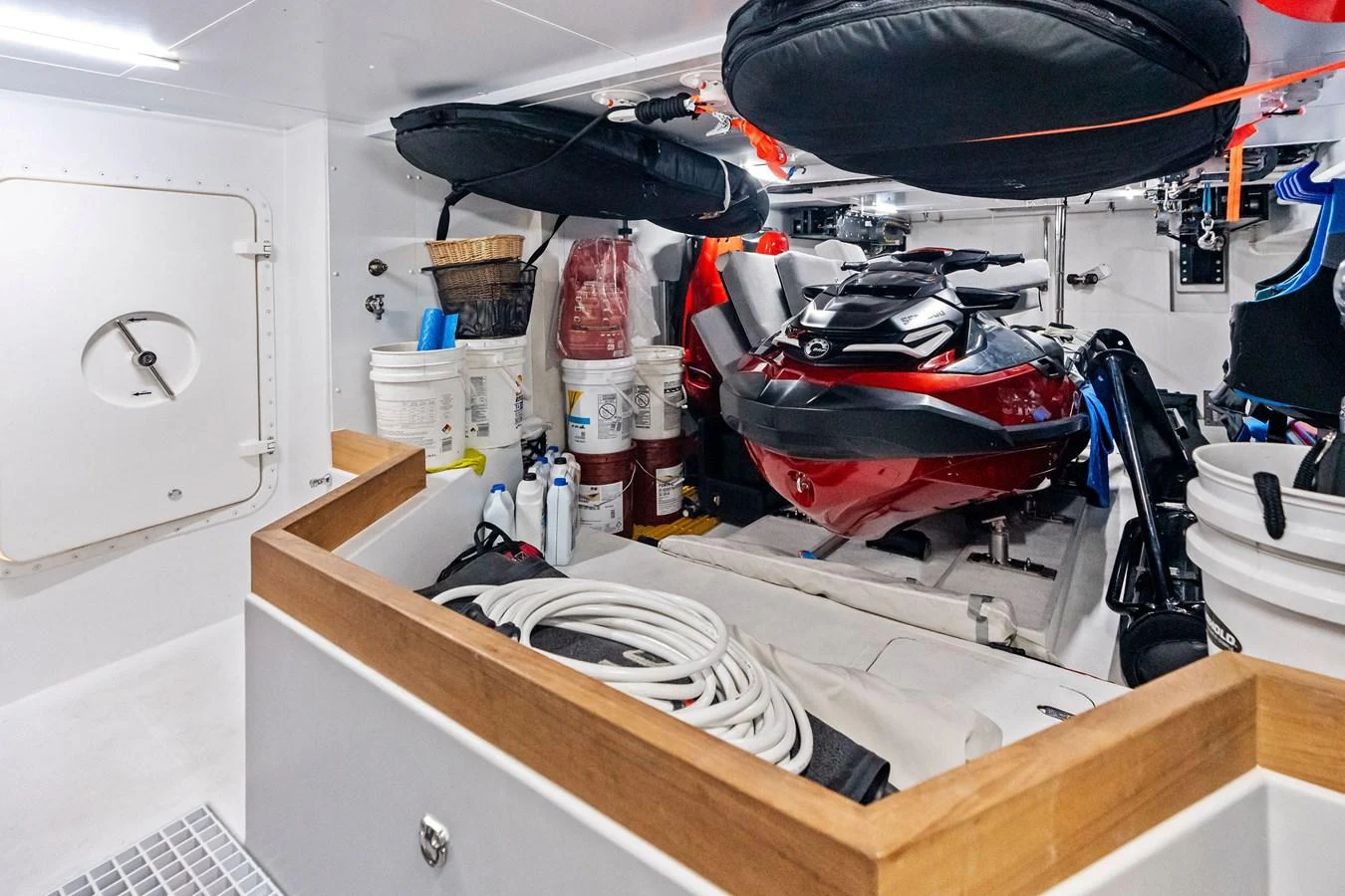 The yacht's toy garage is well-equipped with a jet ski and various water sports gear. aboard TENACIOUS Yacht for Sale