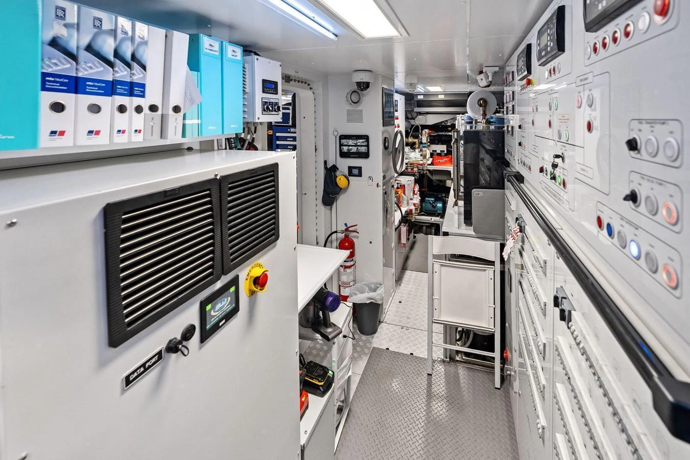 The yacht's engine room is equipped with advanced control panels and essential machinery. aboard TENACIOUS Yacht for Sale