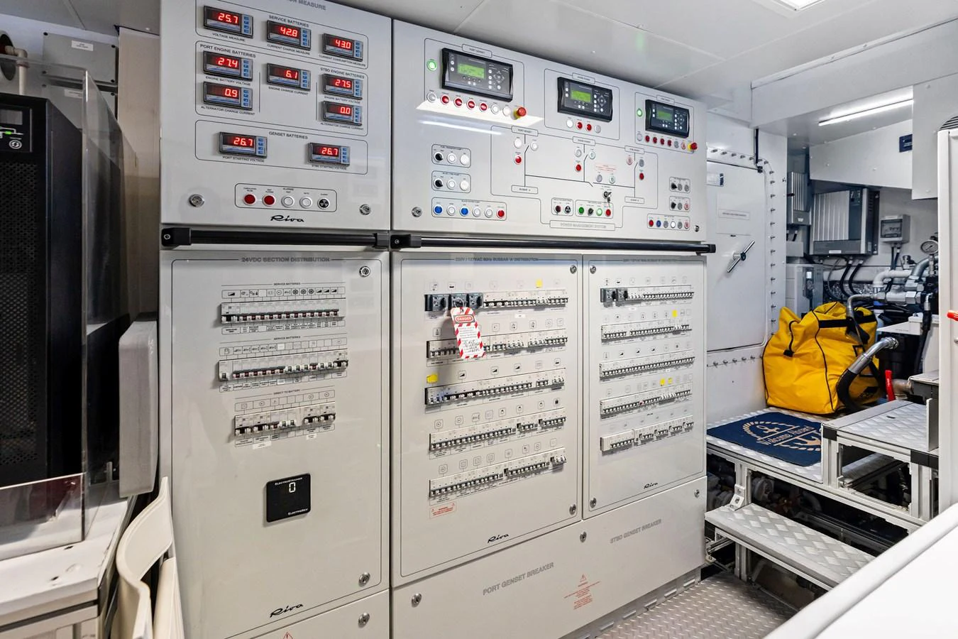 The image showcases the yacht's well-organized and advanced engine room control panels. aboard TENACIOUS Yacht for Sale
