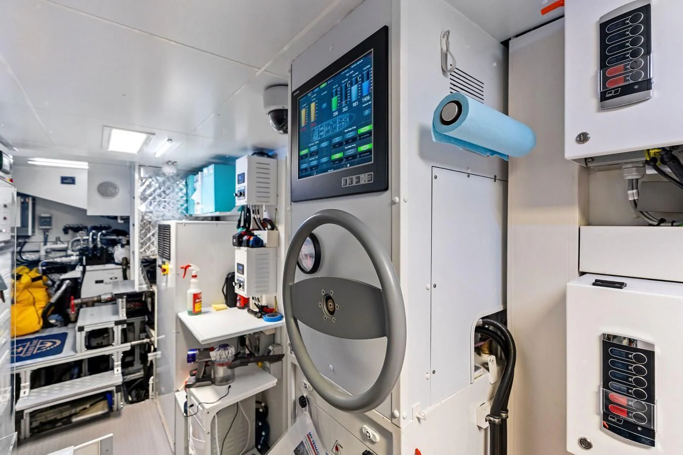 The engine room is equipped with advanced control systems and well-organized machinery. aboard TENACIOUS Yacht for Sale