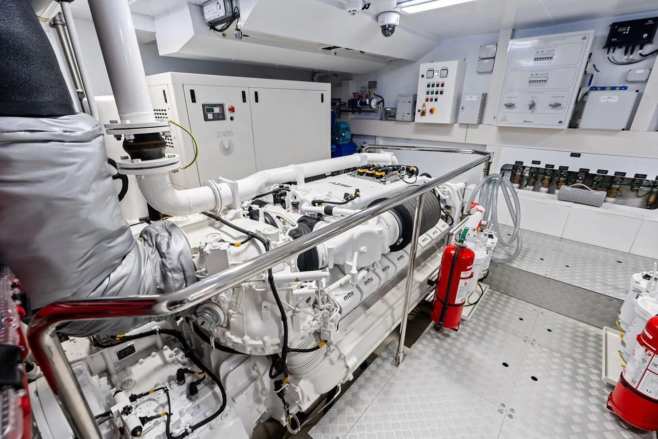 The image showcases the well-maintained engine room of the yacht, highlighting its advanced machinery and equipment. aboard TENACIOUS Yacht for Sale