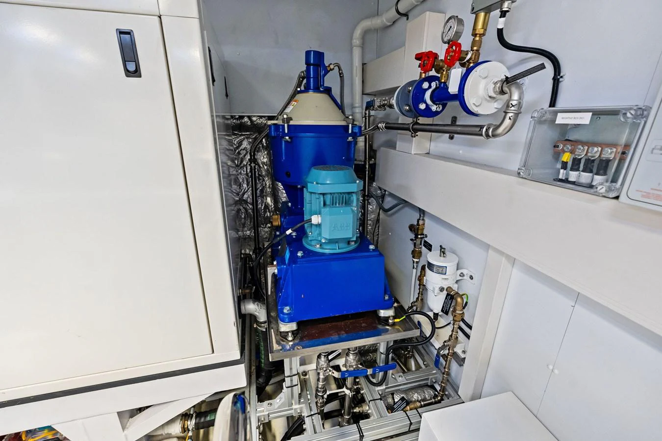 The image showcases the well-organized and clean engine room of the yacht, highlighting its advanced machinery. aboard TENACIOUS Yacht for Sale
