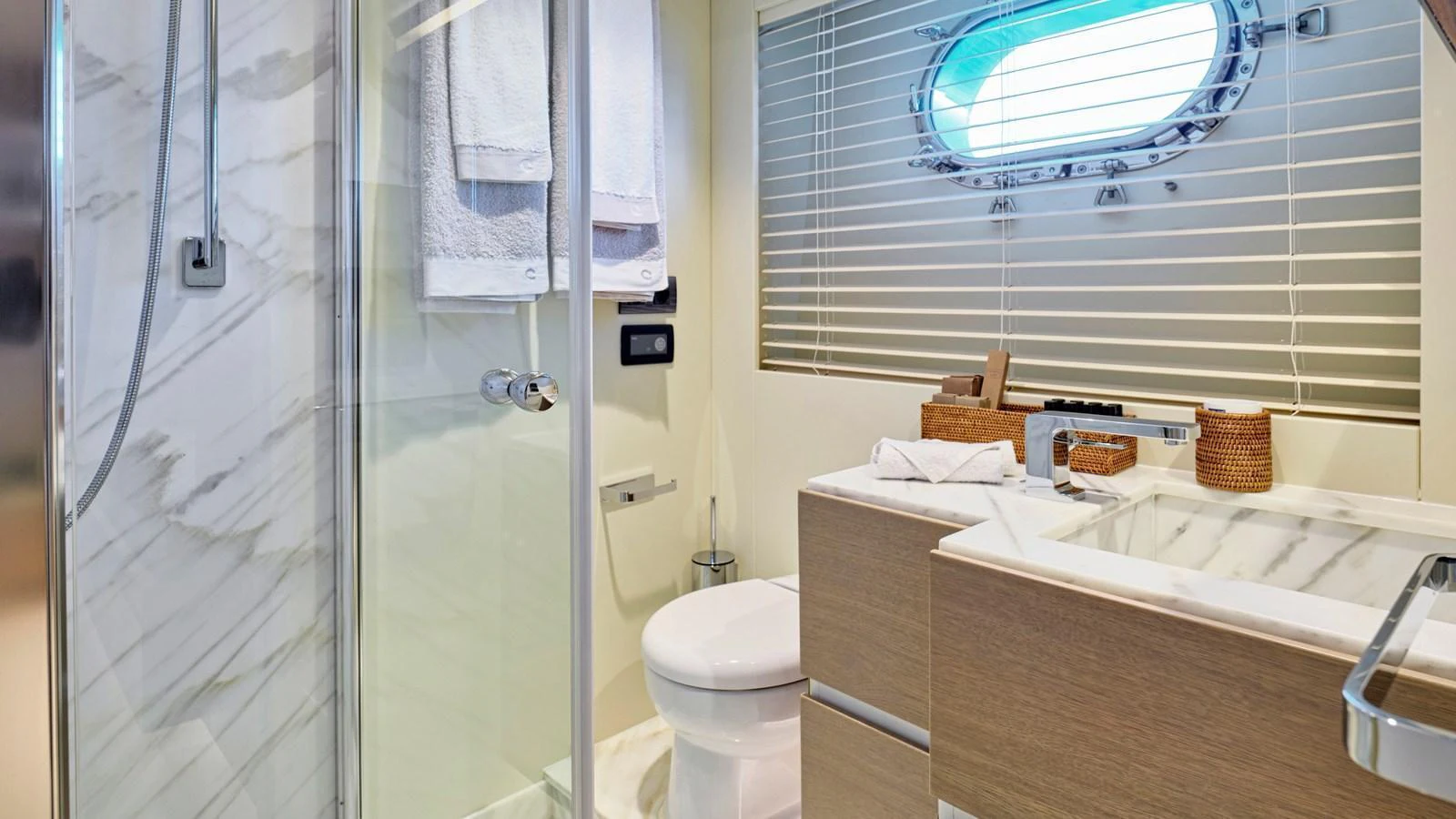 The yacht's bathroom features a modern design with a glass-enclosed shower and sleek fixtures. aboard MILGAUSS Yacht for Sale