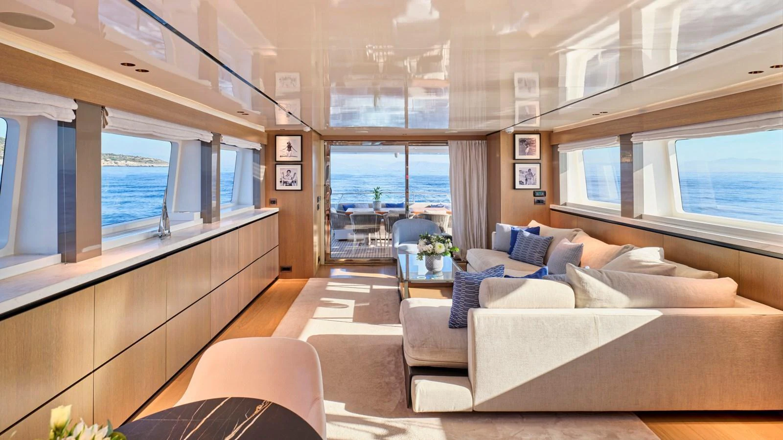 The salon offers a spacious and luxurious living area with panoramic ocean views. aboard MILGAUSS Yacht for Sale