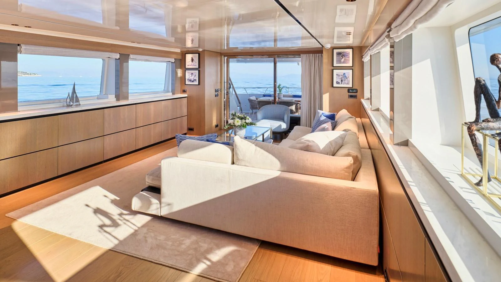 The salon features a spacious and elegantly designed seating area with panoramic ocean views. aboard MILGAUSS Yacht for Sale