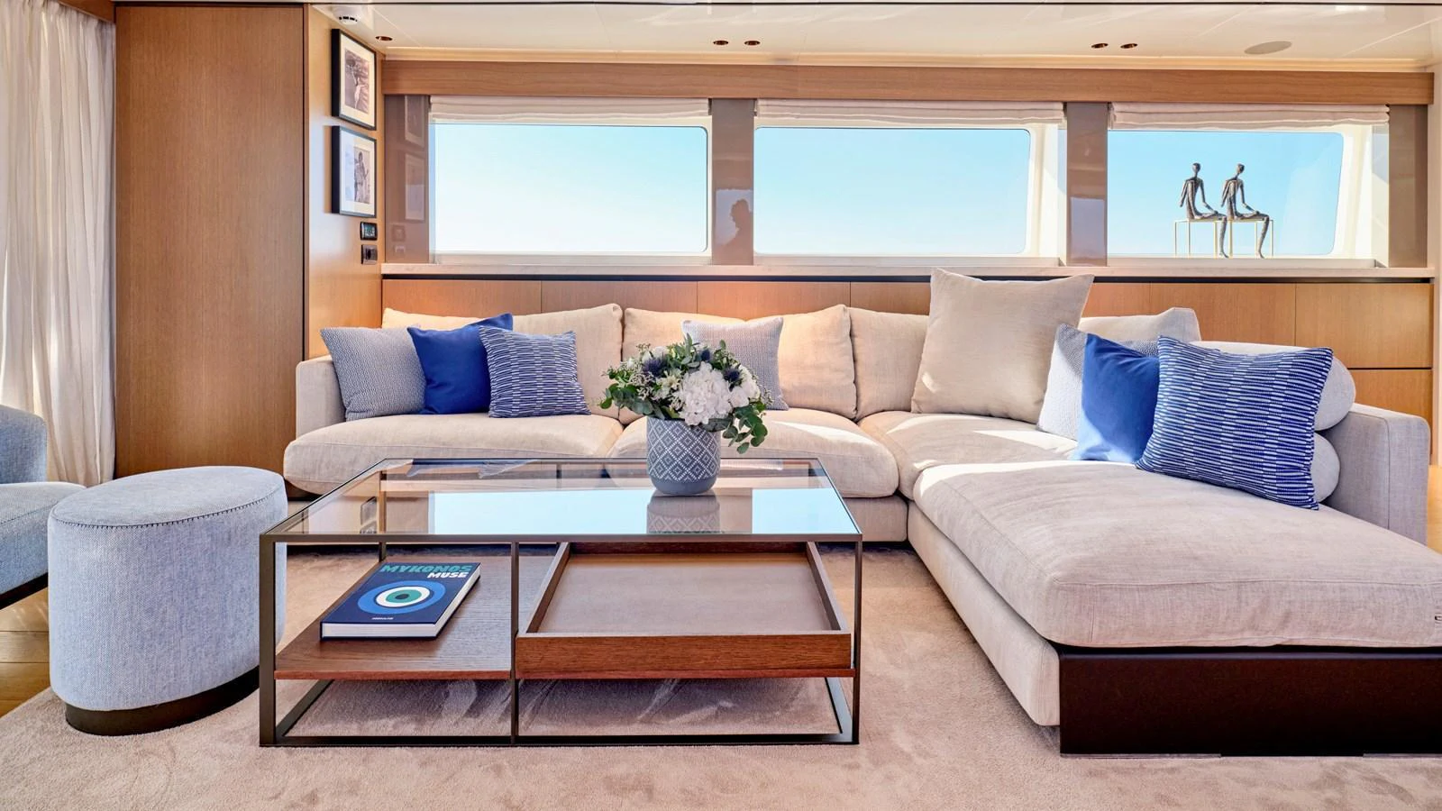 The salon features a spacious and elegantly furnished seating area with large windows offering stunning views. aboard MILGAUSS Yacht for Sale