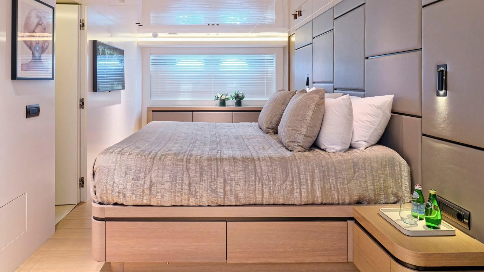 The master stateroom features a luxurious bed with elegant bedding and modern decor. aboard MILGAUSS Yacht for Sale