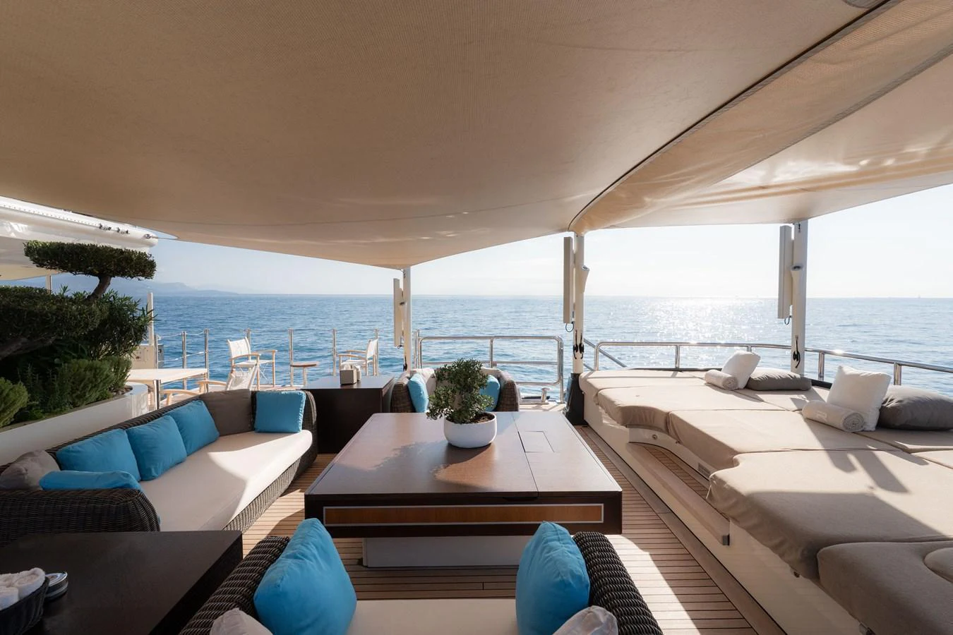 The aft deck offers a luxurious lounging area with comfortable seating and stunning ocean views. aboard RENEGADE Yacht for Sale