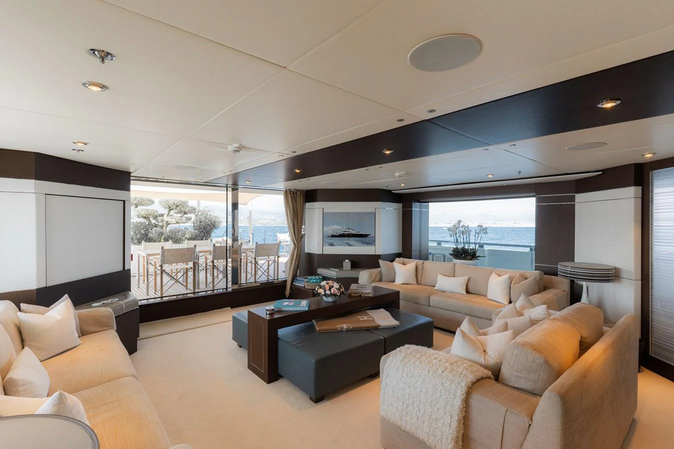 The spacious salon offers a luxurious and comfortable seating area with panoramic views. aboard RENEGADE Yacht for Sale