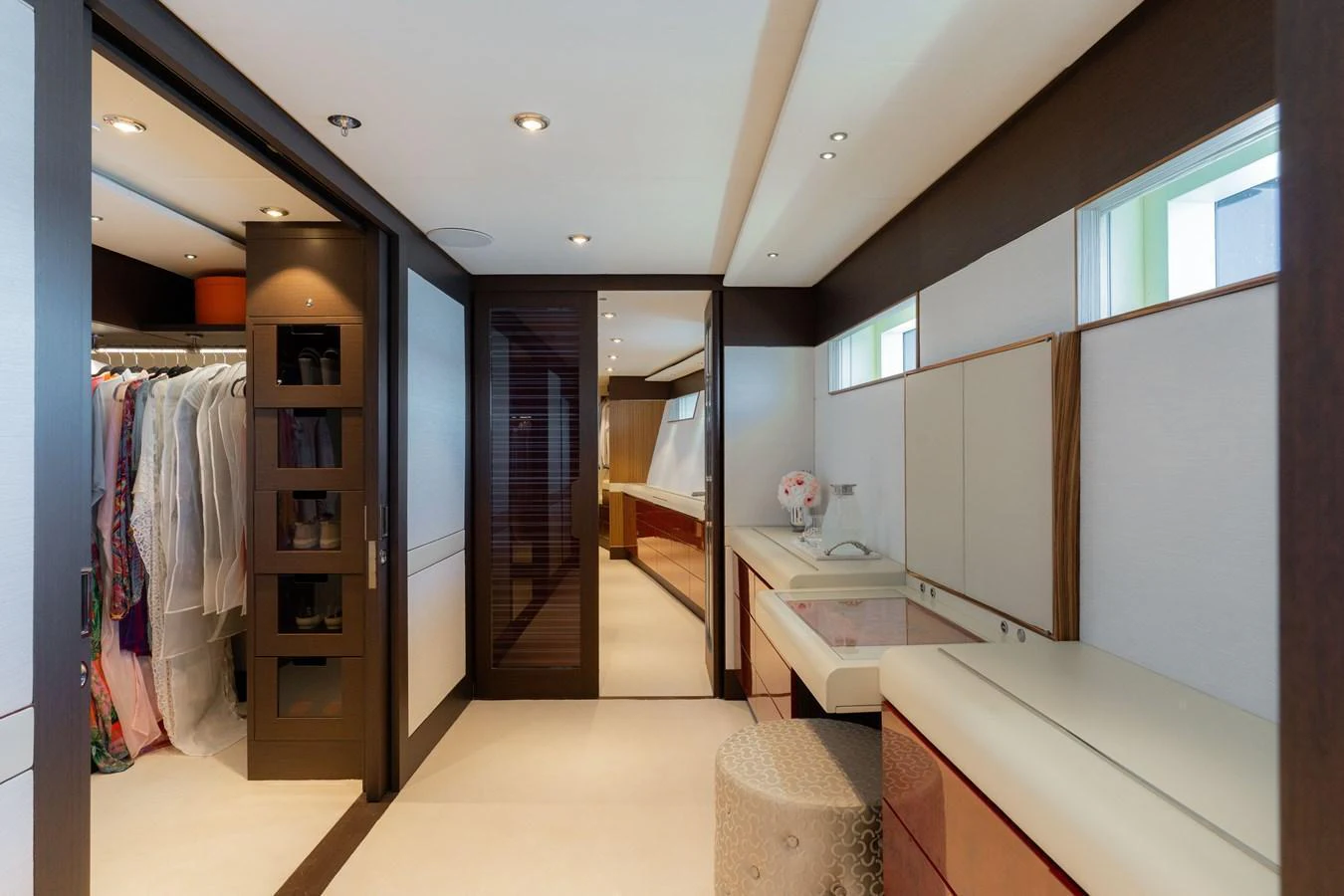 This luxurious walk-in closet features ample storage space and elegant design elements. aboard RENEGADE Yacht for Sale